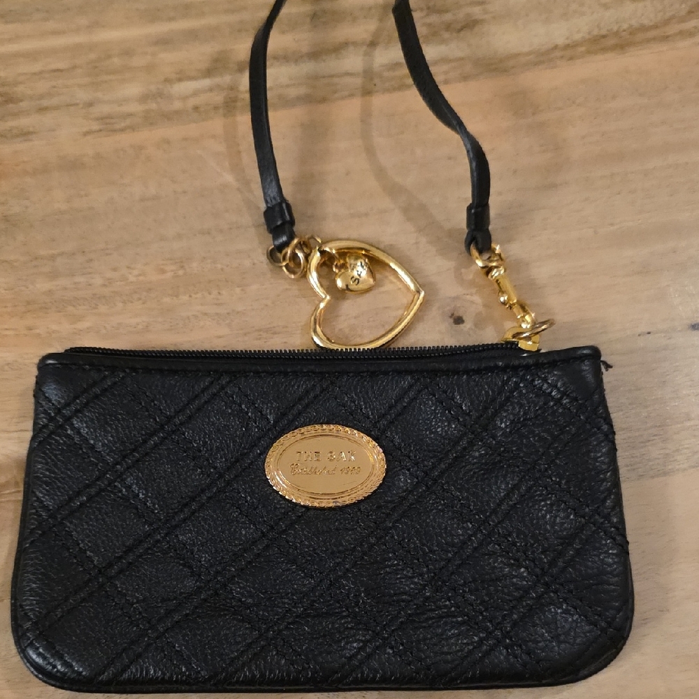 The Sak Black Quilted Wristlet with Gold Heart Charm
